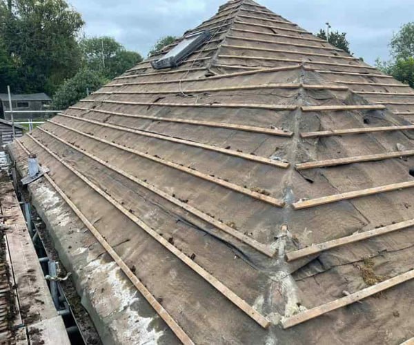 This is a photo of a hip roof that has been stripped back to the battens, and is awaiting a new roof covering to be installed. Works carried out by HJT Roofing Gainsborough